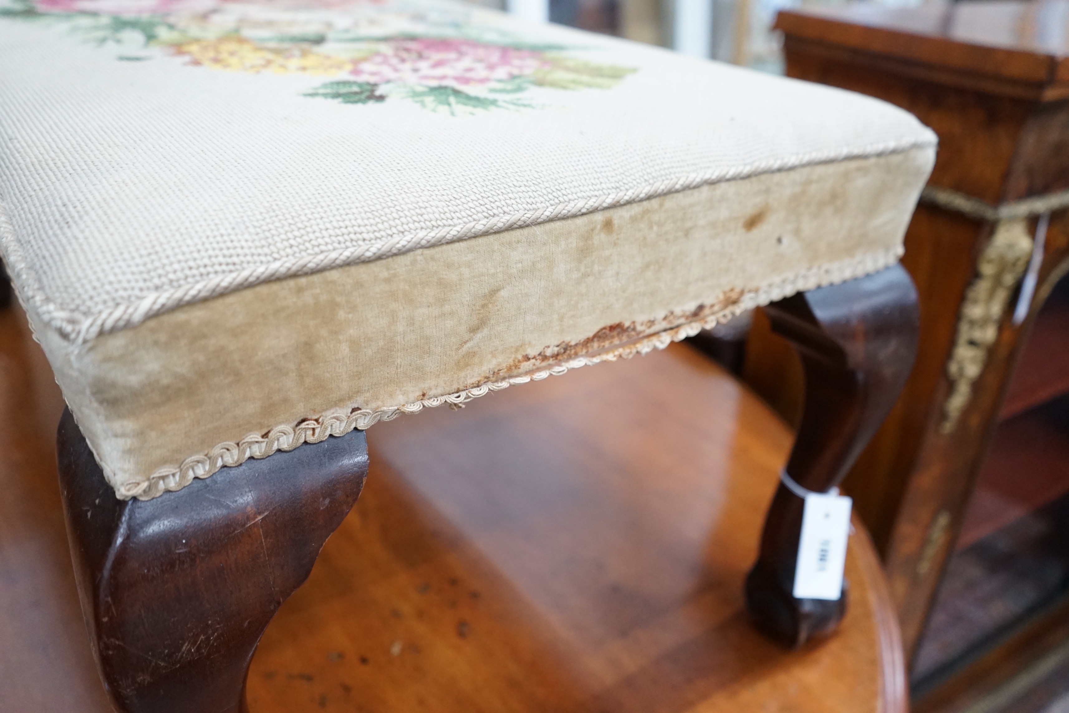 A George II style mahogany dressing stool with tapestry seat width 100cms, depth 50cms, height 40cms.